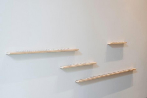 Pedro Tyler, La distancia mas corta, 2014. Metal measuring tape and wood, Variable dimensions.