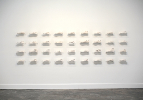 Clarissa Tossin, Ladr&atilde;o de T&ecirc;nis (Sneaker Thief), 2009. Hydrocal and acrylic shelves. Dimensions variable.
