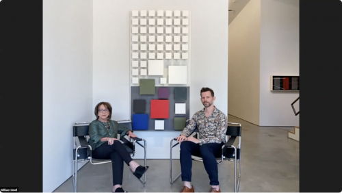 Maria Ines Sicardi [left] and Will Isbell [right] seated in front of Jesús Rafael Soto's Color Inferior, 1991, wood and metal, 79 7/8 x 40 1/8 in.